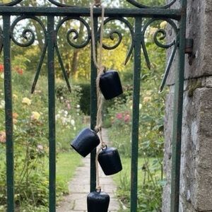 BOHEMIAN HANGING SET OF FOUR STEEL BELLS. HANG WITH JUTE MACRAMÉ STRING.